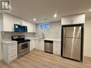 Markham (Bullock) apartment for rent - A kitchen with white cabinets and a stainless steel refrigerator.