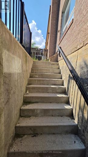 Vaughan (Brownridge) apartment for rent - A set of stairs with a metal railing on the side.