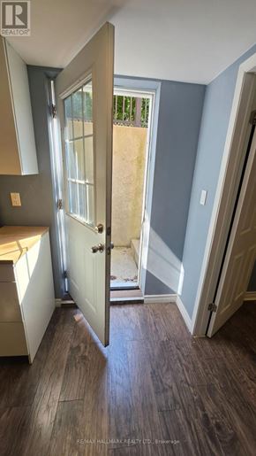 Vaughan (Brownridge) apartment for rent - A hallway with a door leading to a backyard.