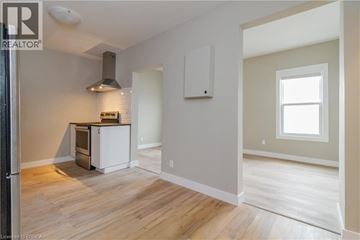 Brantford apartment for rent - A kitchen area with a stove and a refrigerator.