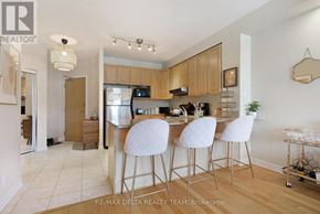 Ottawa condo for rent - A kitchen with a bar stool and a dining table.