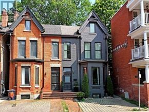 Toronto (Annex) apartment for rent - A red brick house with a grey house next to it.
