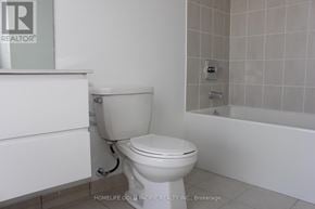 Toronto (Tam O'shanter-Sullivan) condo for rent - A white toilet in a bathroom with a bathtub and a shower.