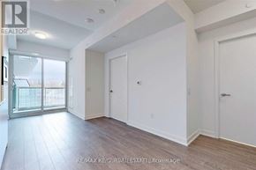 Toronto (Banbury-Don Mills) condo for rent - A spacious room with a sliding glass door leading to a balcony.