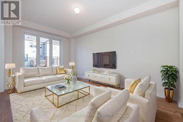 Barrie townhouse for rent - A living room with a glass coffee table and white furniture.
