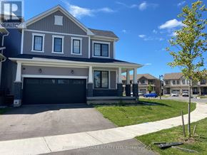 Brantford apartment for rent - A two-story house with a garage is for sale.