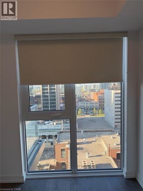 Hamilton condo for rent - A window with a view of a cityscape.