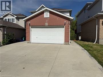 Kitchener apartment for rent - A garage with the number 67 on it.