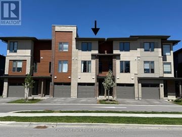 Collingwood townhouse for rent - A building with a sign that says REALTOR in the corner.