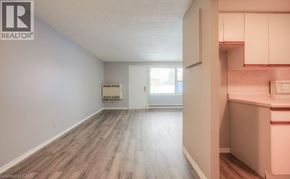 Kitchener townhouse for rent - A room with a window and a door leading to another room.