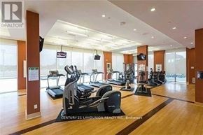 Toronto (Agincourt South-Malvern West) condo for rent - A gym with treadmills and exercise bikes is part of a realtor's office.