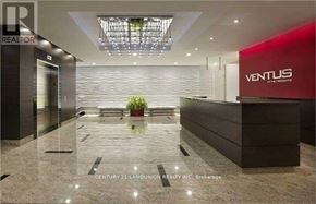Toronto (Agincourt South-Malvern West) condo for rent - The image shows a modern office lobby with a reception desk and a potted plant.