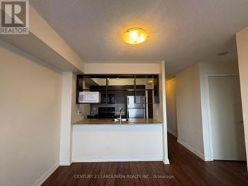 Toronto (Agincourt South-Malvern West) condo for rent - A kitchen area with white cabinets and a countertop.