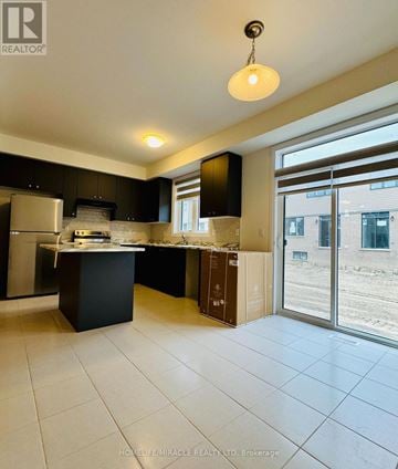 Thorold (Rolling Meadows) duplex for rent - A kitchen with black cabinets and a white countertop.