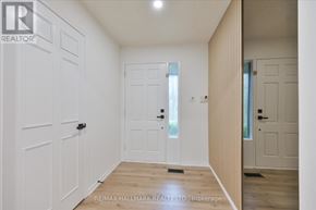 King (King City) apartment for rent - A white hallway with a door on the left and a door on the right.