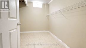 Aurora apartment for rent - A white door with a glass window is set in a brick wall.