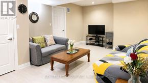 Aurora apartment for rent - A living room with a grey couch, a wooden coffee table, and a yellow and grey striped sofa.