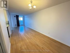 Toronto (Bayview Village) condo for rent - A room with wooden flooring and a white door.