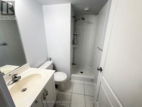 Toronto (Bayview Village) condo for rent - A long hallway with wood floors and a clock on the wall.