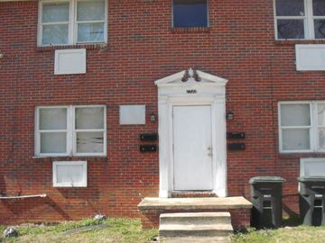 Birmingham apartment for rent - A red brick house with a white door and windows.