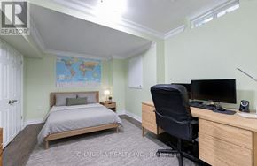 Hamilton (Waterdown) apartment for rent - A bedroom with a bed, desk, and chair.