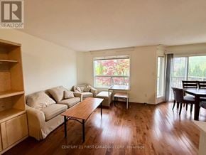 London North (North M) apartment for rent - A living room with a couch, chairs, and a dining table.