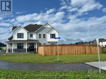 Ottawa apartment for rent - A house with a blue sign in front of it.