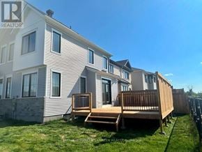 Ottawa apartment for rent - A sunny day at a residential area with houses and green lawns.