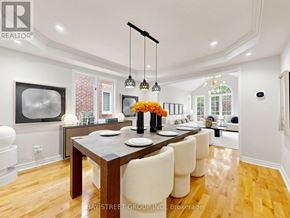 Aurora (Aurora Highlands) apartment for rent - A modern dining room with a wooden table and white chairs.