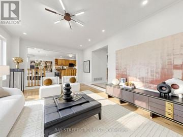 Aurora (Aurora Highlands) apartment for rent - A living room with a black coffee table and a ceiling fan.