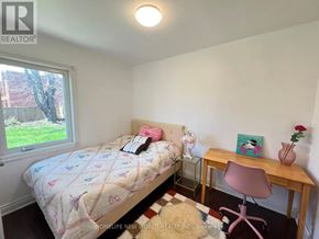 Toronto (Wexford-Maryvale) apartment for rent - A bedroom with a bed, desk, and chair.