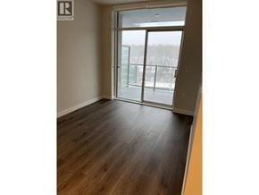 Vancouver apartment for rent - A room with a sliding glass door leading to a balcony.