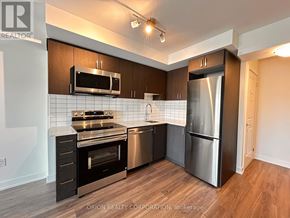 Pickering (Bay Ridges) condo for rent - A kitchen with a stainless steel refrigerator and oven.