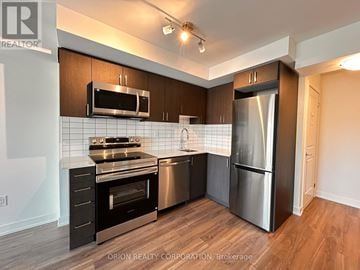 Pickering (Bay Ridges) condo for rent - A kitchen with a stainless steel refrigerator and oven.