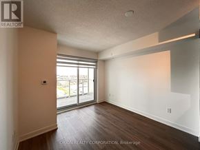 Pickering (Bay Ridges) condo for rent - A room with a sliding glass door leading to a balcony.
