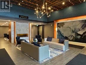 Hamilton (Waterdown) condo for rent - A modern living room with a fireplace and a large painting on the wall.