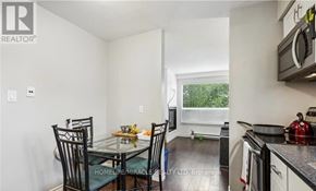 Kitchener triplex for rent - A kitchen with a dining table and chairs.