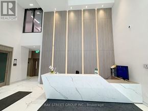 Toronto (Church-Yonge Corridor) condo for rent - A reception area with a marble counter and a sign that says "REALTOR".