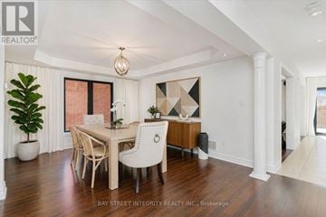 Oakville (Wm Westmount) apartment for rent - A dining room with a wooden table and chairs.