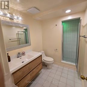 Markham (Thornlea) apartment for rent - A bathroom with a toilet, sink, and shower.