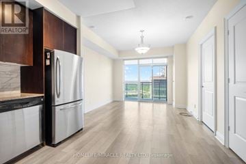 Toronto (Mimico) condo for rent - A modern living room with a glass table and a sofa.