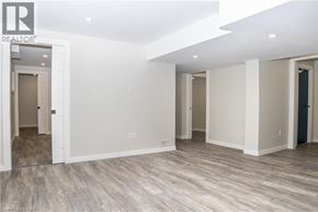 Caledonia apartment for rent - A room with a white door and a grey floor.