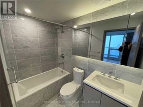Toronto (Bayview Village) condo for rent - A bathroom with a toilet, sink, and bathtub.
