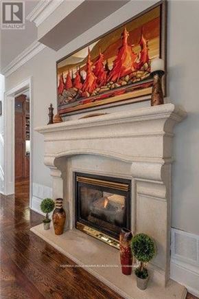 Toronto (Bedford Park-Nortown) apartment for rent - A painting of a fire is above a fireplace.