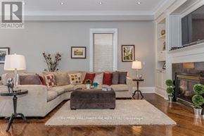 Toronto (Bedford Park-Nortown) apartment for rent - A living room with a couch, a coffee table, and a fireplace.
