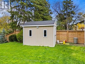Mississauga (Clarkson) apartment for rent - A small shed sits in a grassy backyard.