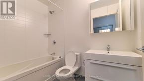 Markham (Unionville) condo for rent - A white bathroom with a toilet, sink, and bathtub.