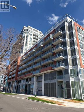 Richmond Hill (South Richvale) condo for rent - A modern multi-story building with balconies and a glass facade.