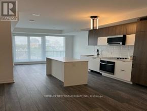 Richmond Hill (South Richvale) condo for rent - A modern kitchen with a large island in the middle.