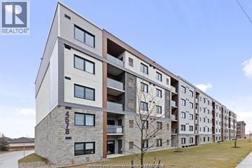 Lasalle condo for rent - A modern apartment building with the number 4578 on the front.